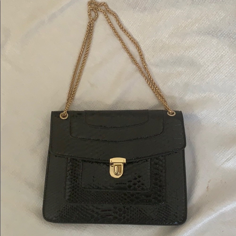 Black snakeskin and gold shoulder bag